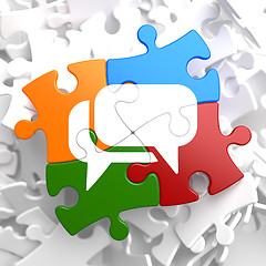 Image showing White Speech Bubble Icon on Multicolor Puzzle.