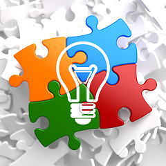 Image showing Light Bulb Icon on Multicolor Puzzle.