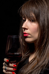 Image showing Young woman with red wine from a glass