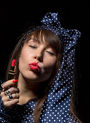 Image showing Sexy sensual woman applying red lipstick