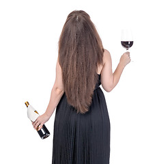 Image showing Woman with a bottle of red wine