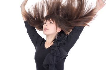 Image showing Young woman with her hair flying in the air