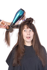 Image showing Woman enjoying having her hair blow dried