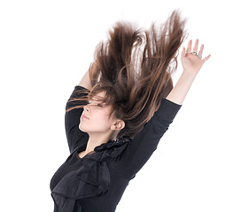 Image showing Young woman with her hair flying in the air