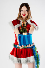 Image showing Beautiful and sexy christmas woman with gift