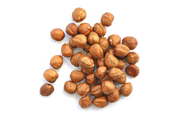 Image showing handful of nuts of a filbert on a white background