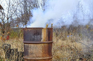 Image showing Smoke from a barrel with garbage on a country site