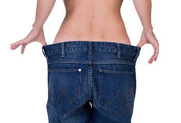 Image showing slim girl in big jeans