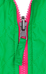 Image showing pink zipper on the green jacket