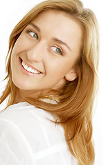 Image showing lovely girl with green eyes looking over shoulder