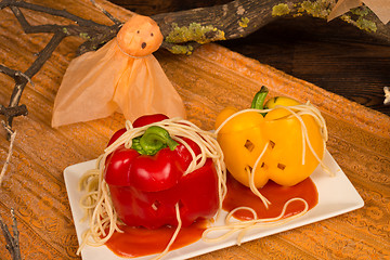 Image showing Fake pumpkins with pasta worms