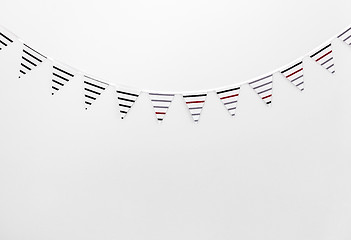 Image showing Black and white bunting decorating a wall