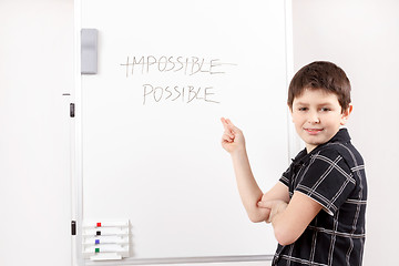 Image showing happy little boy and white board