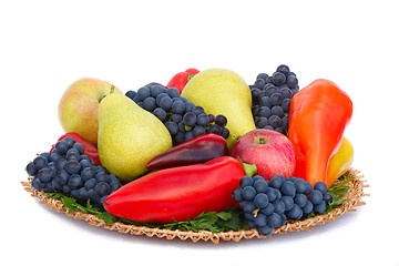 Image showing Fruits , pepper and parsley leaves on a plate on a white backgro