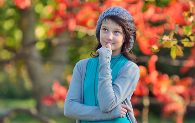 Image showing girl thinking in nature on background of autumn