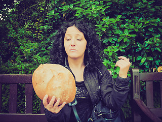 Image showing Girl eating bread