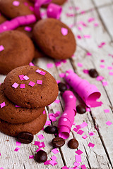 Image showing chocolate cookies, coffee beans, pink ribbons and confetti