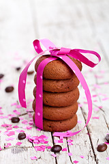 Image showing cookies tied with pink ribbon, confetti and coffee beans