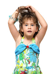 Image showing adorable little girl raises her hair