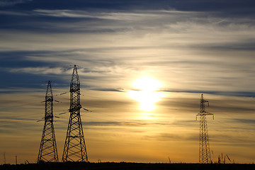 Image showing electric masts at sunset