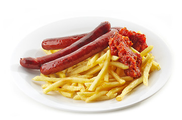 Image showing french fries and grilled sausages