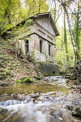 Image showing old house with creek in forest