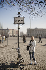 Image showing Woman with antique bike on Lustgarten