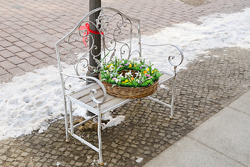 Image showing Basket with flowers on the bench