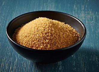 Image showing Cane sugar in a black bowl