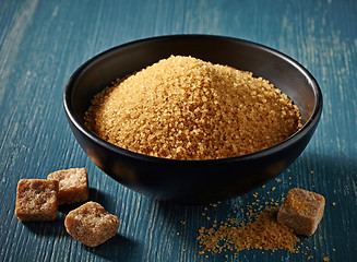 Image showing Cane sugar in a black bowl