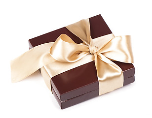 Image showing Box with candies and golden tape