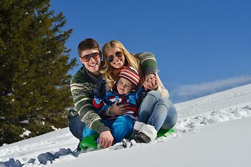 Image showing family having fun on fresh snow at winter