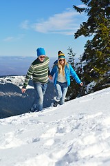 Image showing Young Couple In Winter  Snow Scene