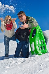 Image showing family having fun on fresh snow at winter