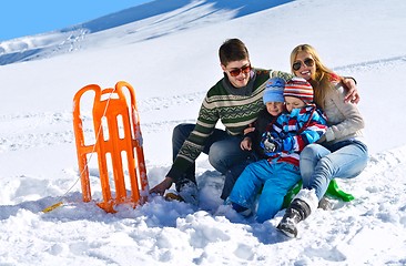 Image showing family having fun on fresh snow at winter