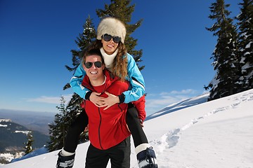 Image showing Young Couple In Winter  Snow Scene