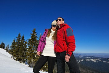 Image showing Young Couple In Winter  Snow Scene