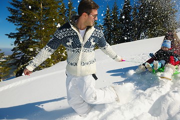 Image showing family having fun on fresh snow at winter