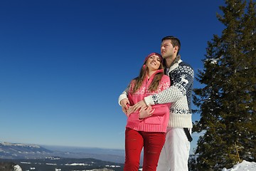 Image showing Young Couple In Winter  Snow Scene