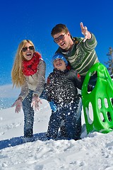 Image showing family having fun on fresh snow at winter