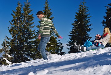 Image showing family having fun on fresh snow at winter