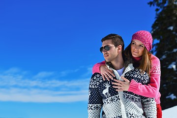 Image showing Young Couple In Winter  Snow Scene