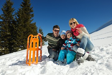 Image showing family having fun on fresh snow at winter