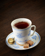 Image showing tea cup and brown sugar cubes