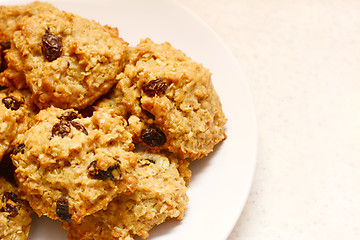 Image showing Plate of delicious oatmeal raisin cookies