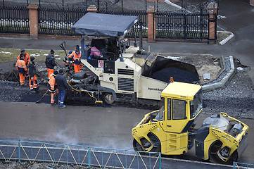 Image showing Special equipment on repair of roads. Bulldozer, asphalt spreade