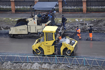 Image showing Special equipment on repair of roads. Bulldozer, asphalt spreade