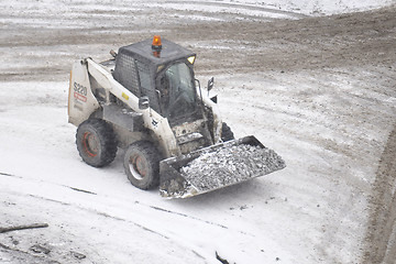 Image showing Special equipment on road. Snowfall