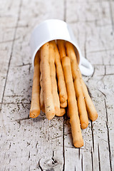 Image showing cup with bread sticks grissini