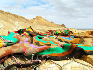 Image showing Colorful cloth lying on a background of mountains